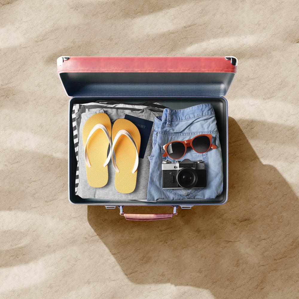 Suitcase showing items for holiday